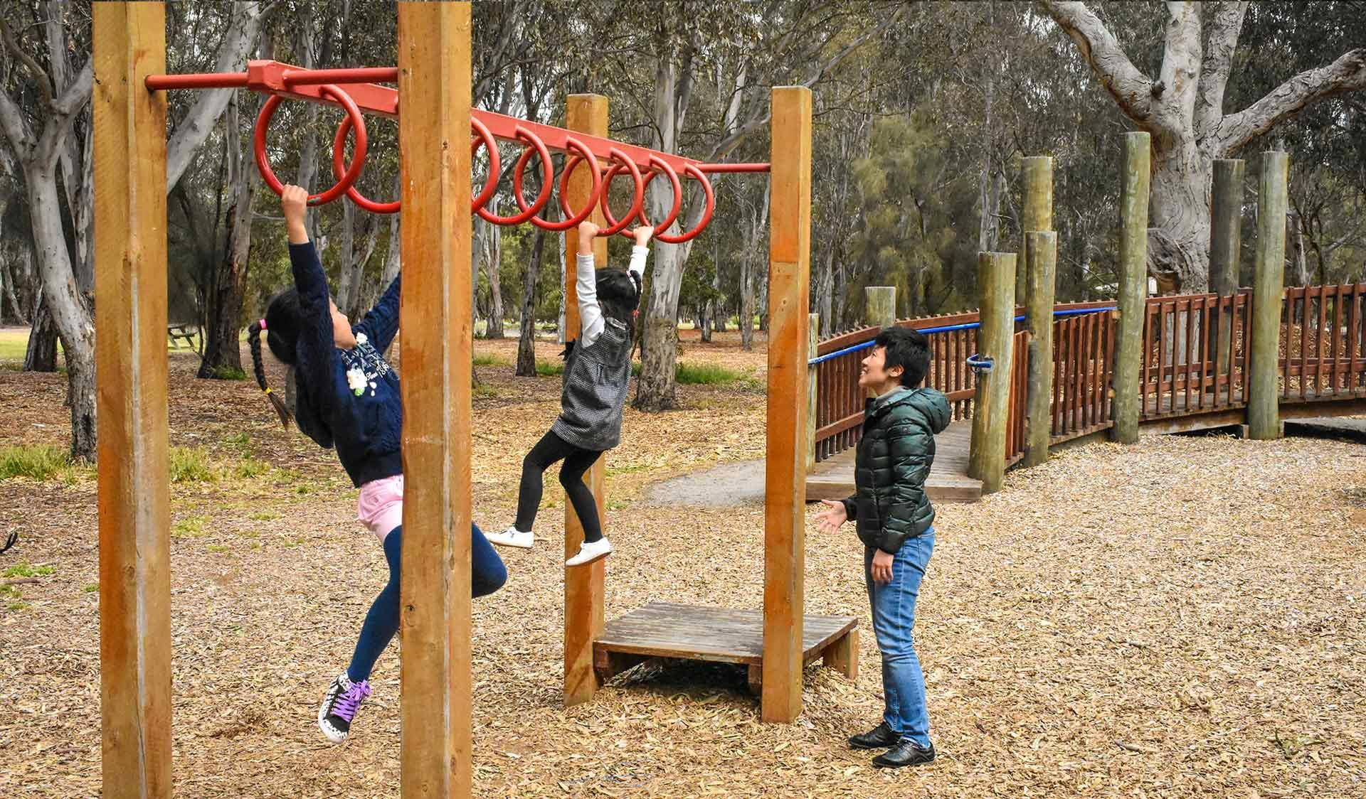 A family plays on the adventure playground at Braeside Park. 