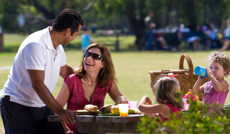 A family picnic on a sunny day at Braeside Park