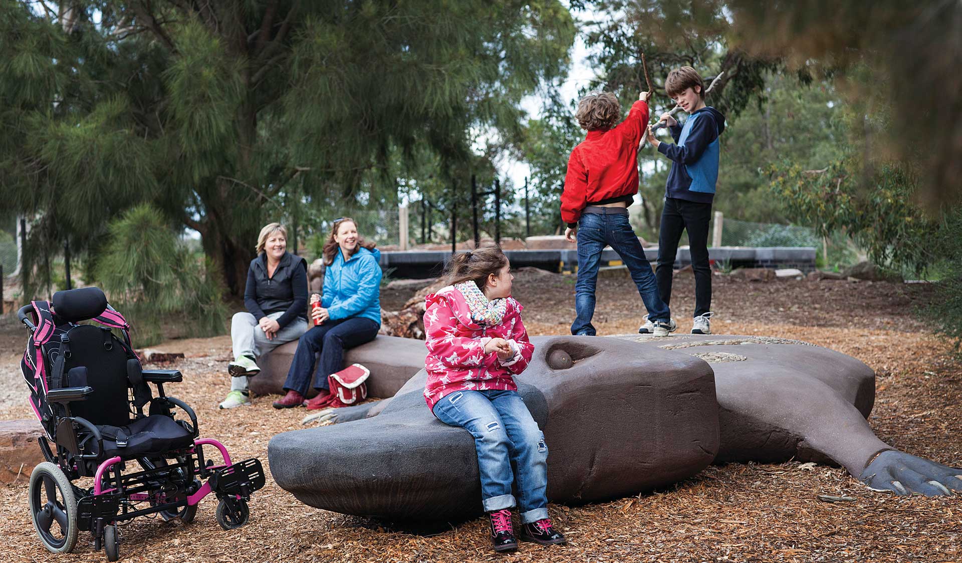 A family plays at the Brimbank Playscape