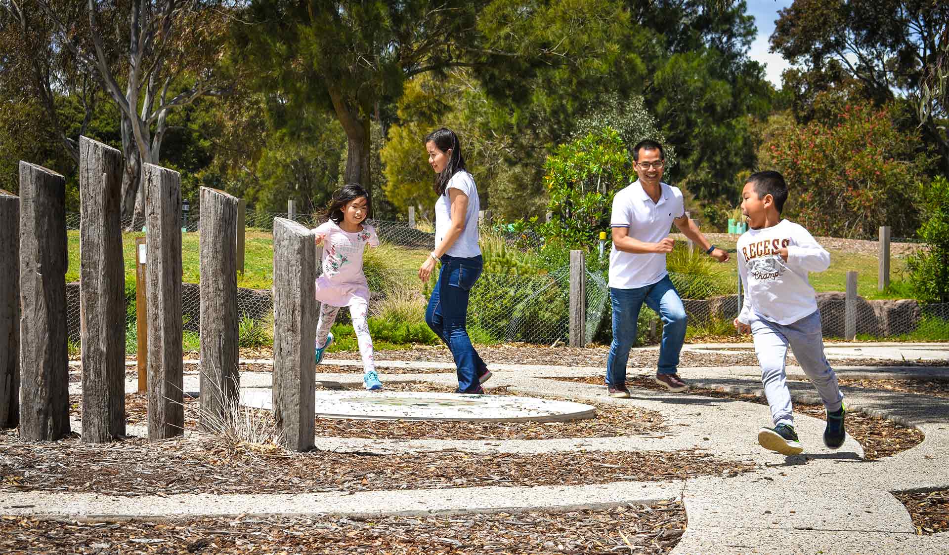 A family plays at the Brimbank Park Playscape