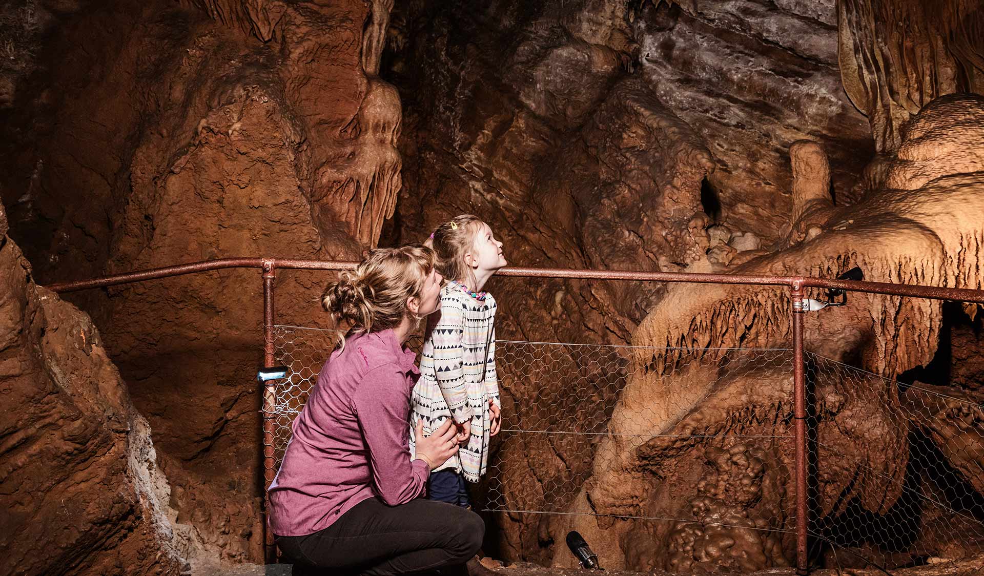 Family exploring Royal cave, Buchan Caves Reserve