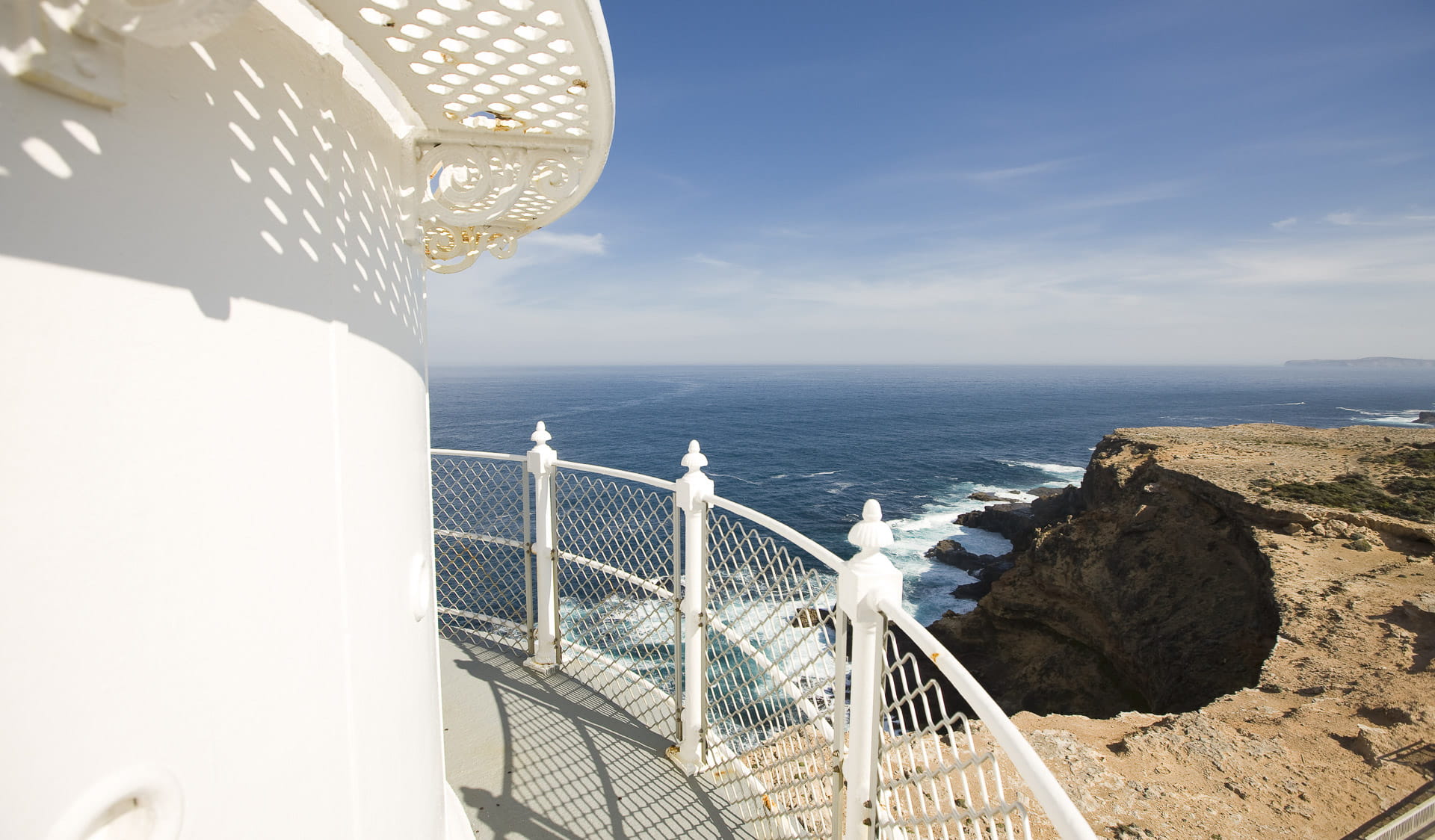 View of a rocky coastline from the top of a lighthouse. 