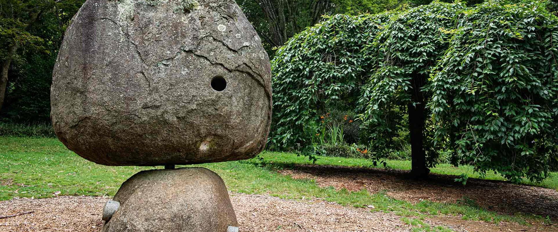 A sculpture in a beautiful garden.