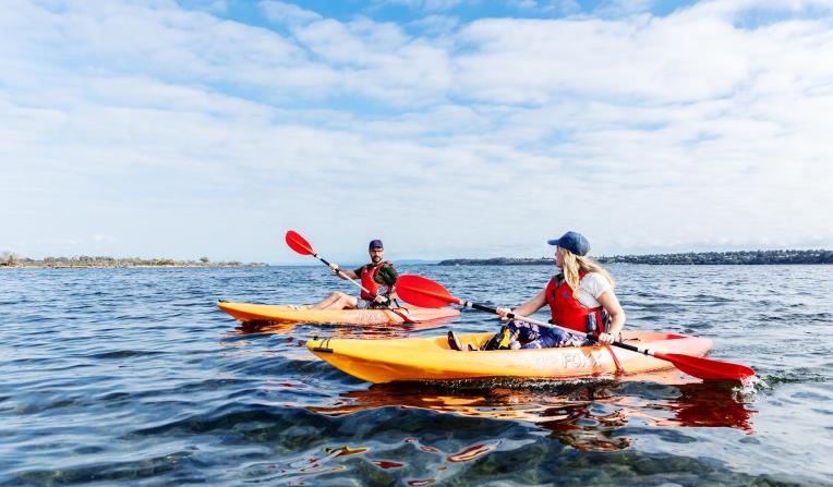 Two kayakers on the Gippsland Lakes near Metung. 