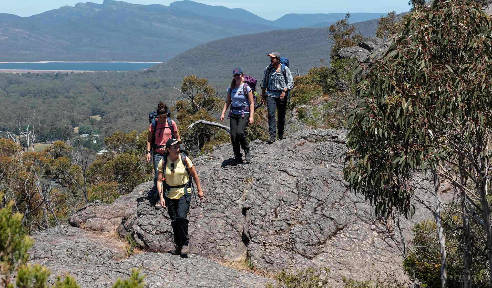 A group of hikers walk along the track near the Chatauqua Peak on the Grampians Peaks Trail 