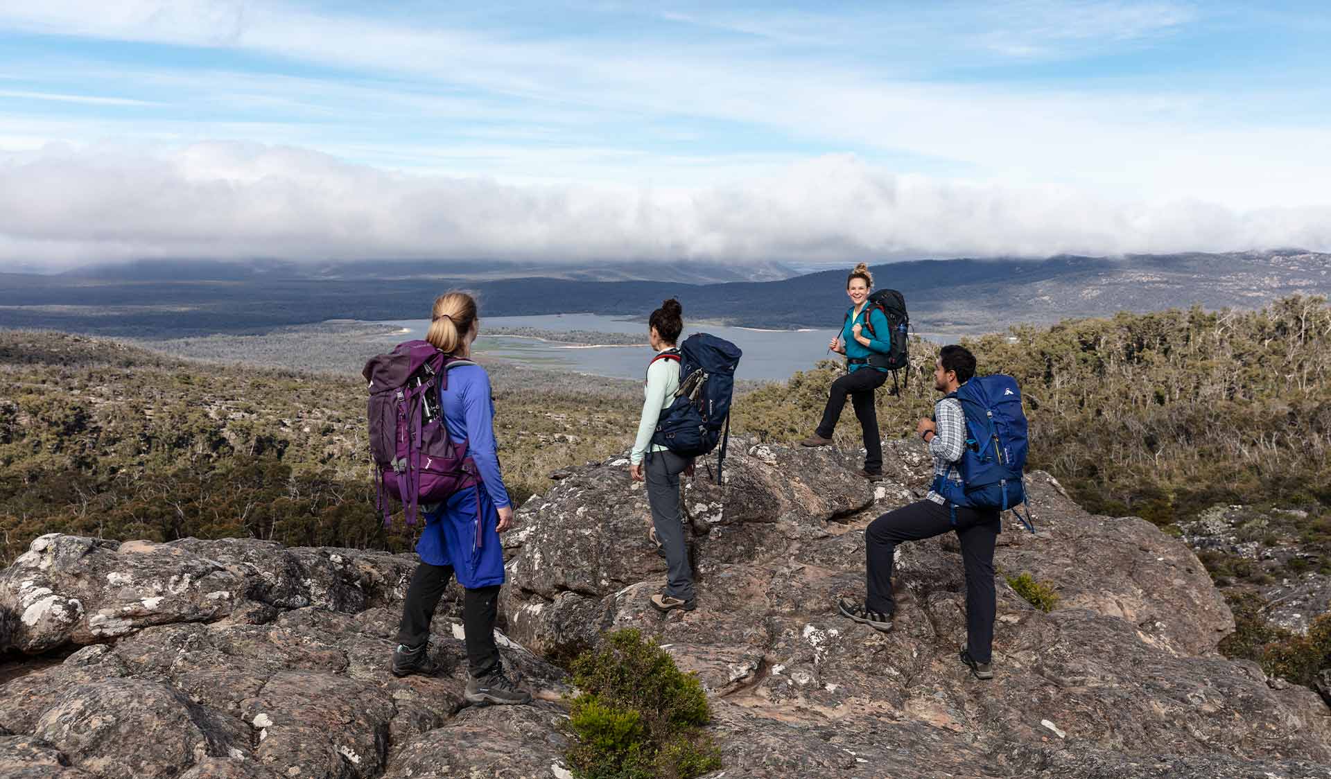 A group of 4 walkers in front of Lake Wartook in the Northern Grampians