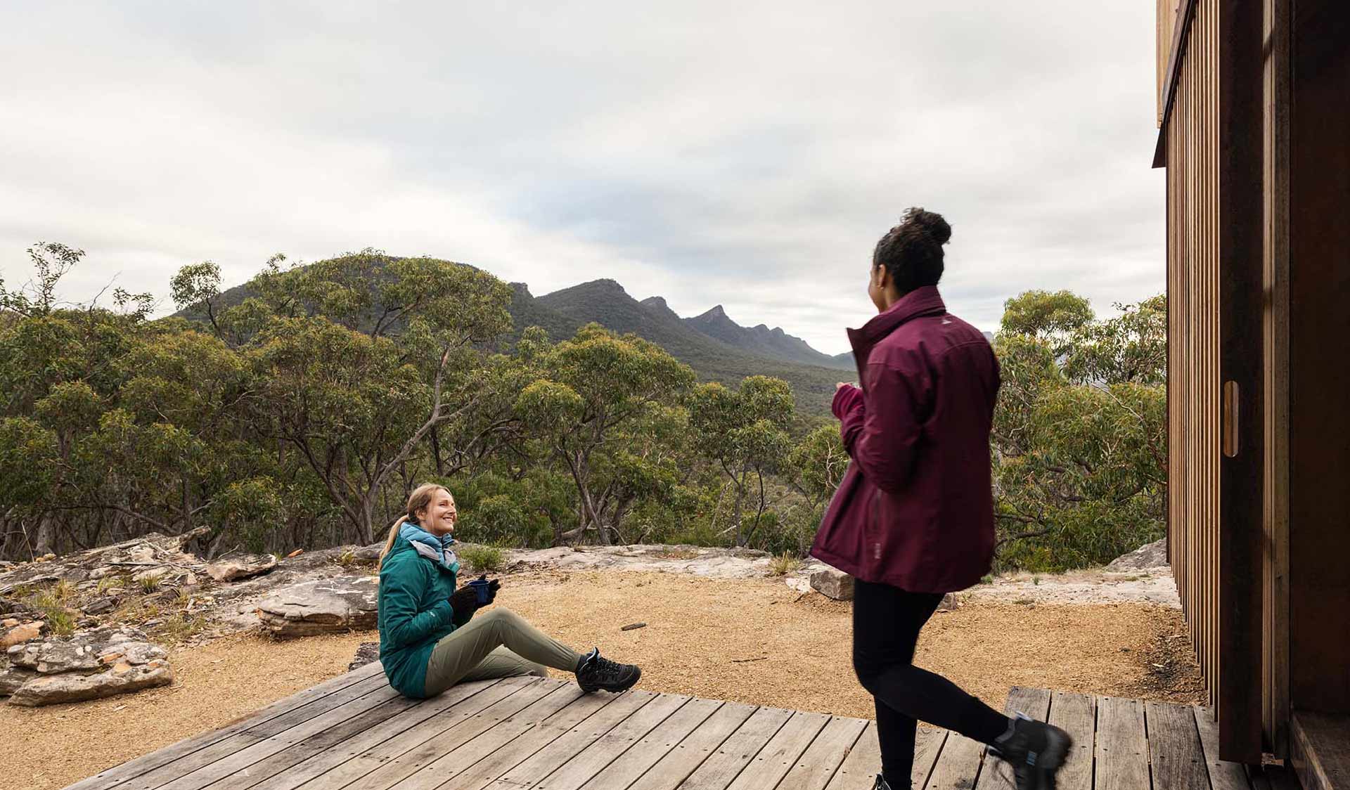 Two women on the porch of the communal shelter at Djardji-Djawara Hiker camp on southern section 2 of the GPT