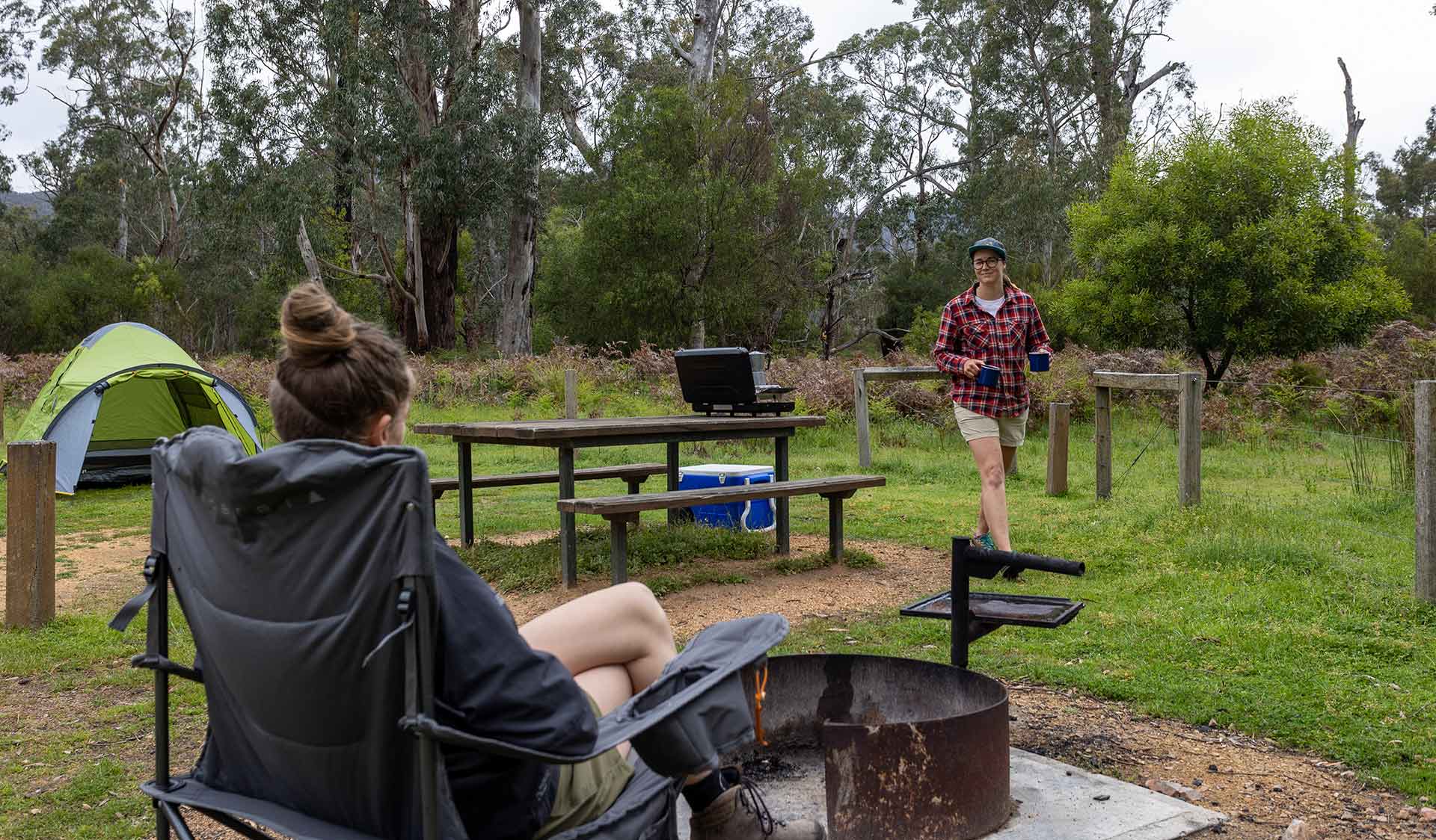 A couple of women enjoy a cup of tea at Jimmy Creek Campground at the Grampians National Park