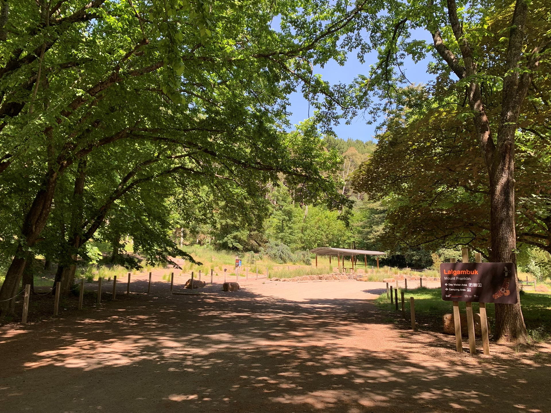 A sign reads Lalgambuk at the entrance to the camping area.