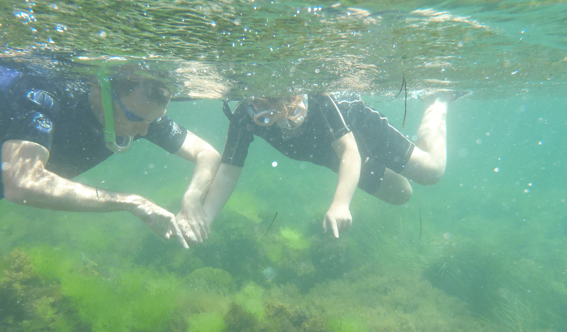 A man and son snorkelling at Jawbone Marine Sanctuary