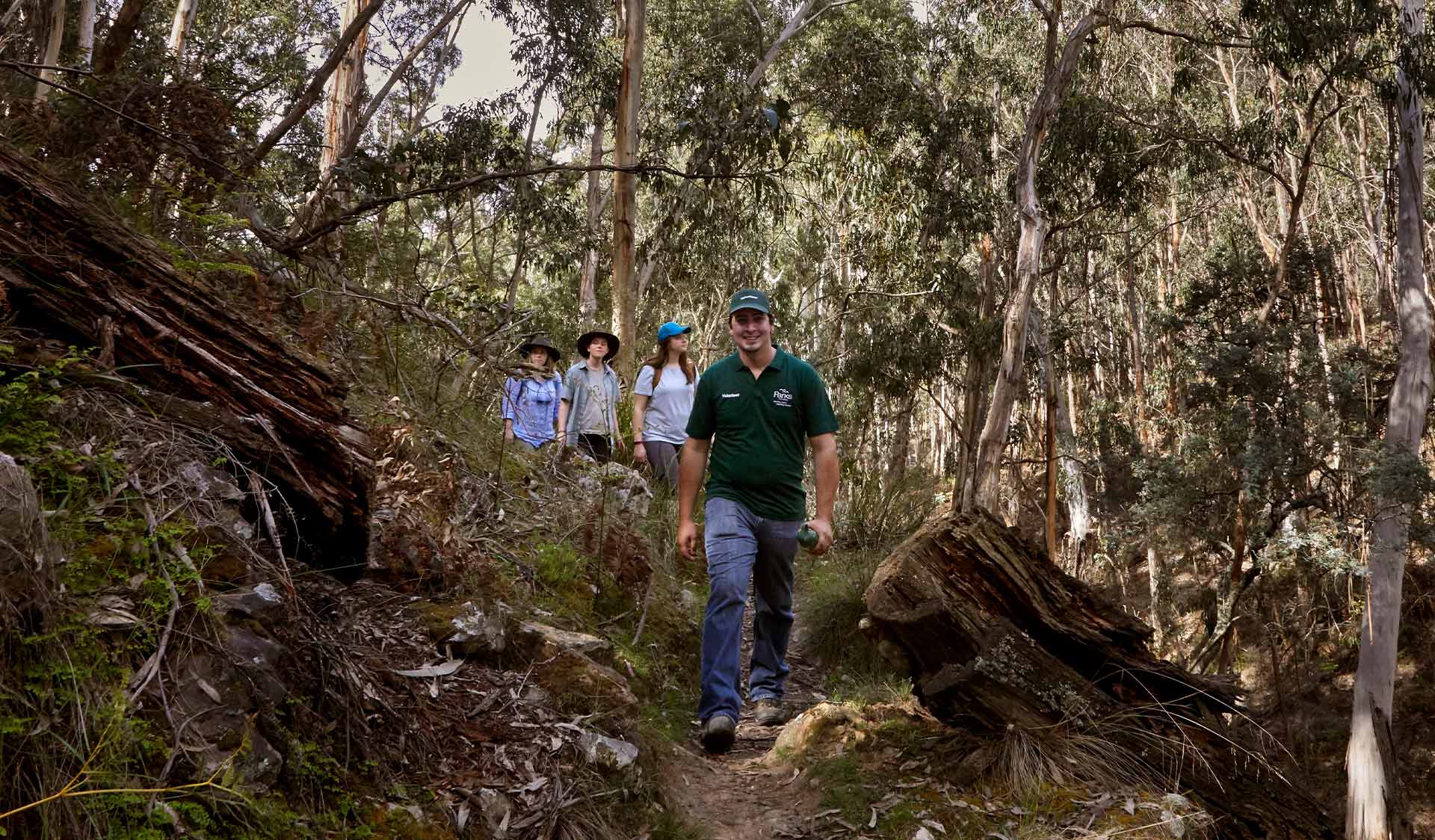 A volunteer tour guide leads a group through Lerderderg State Park. 