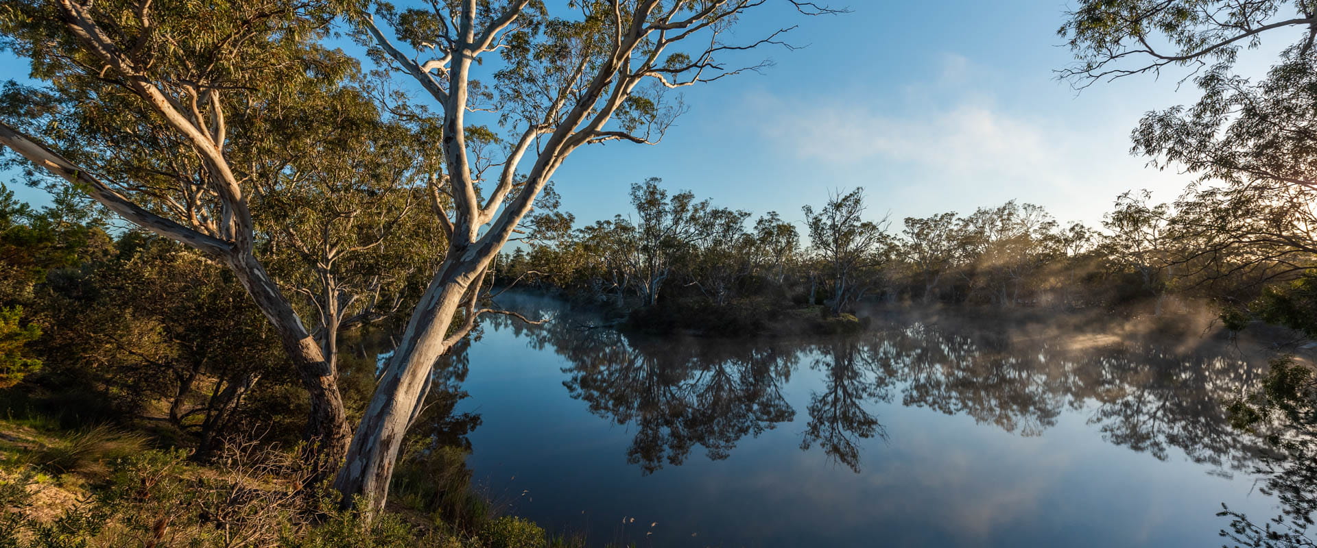 A winding river in a rugged bushland landscape. 