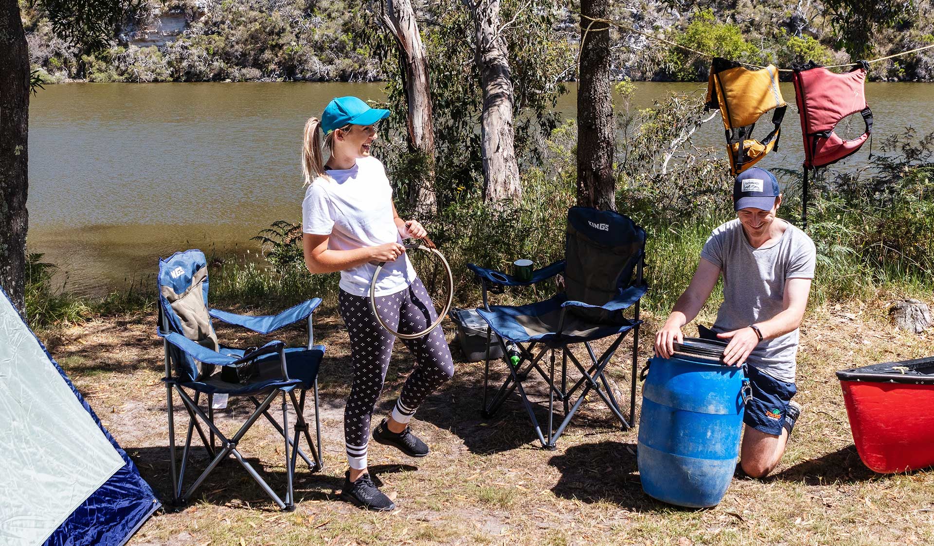 A couple unpack their waterproof barrel at a campsite in the Lower Glenelg National Park.