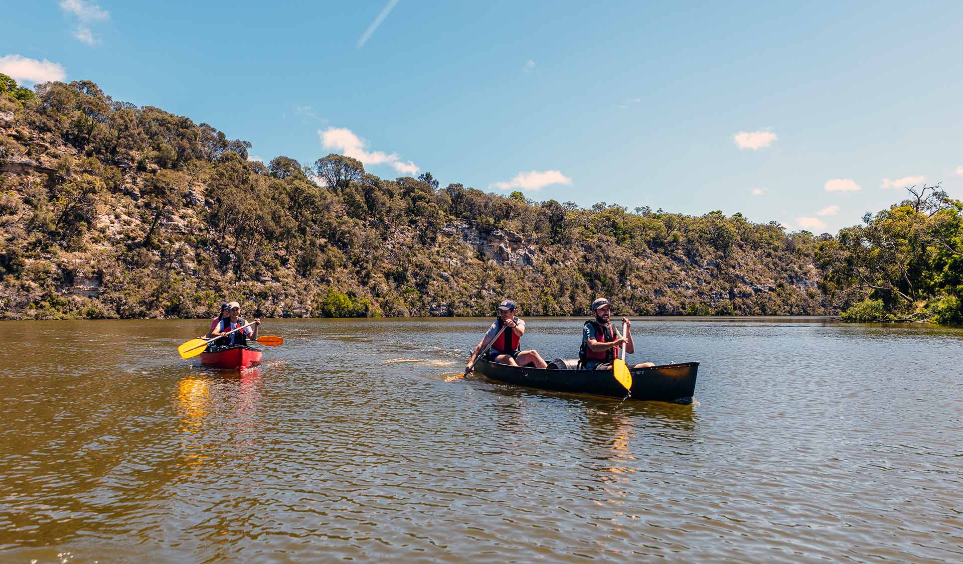 Four friend canoe down the Glenelg River in the Lower Glenelg National Park.