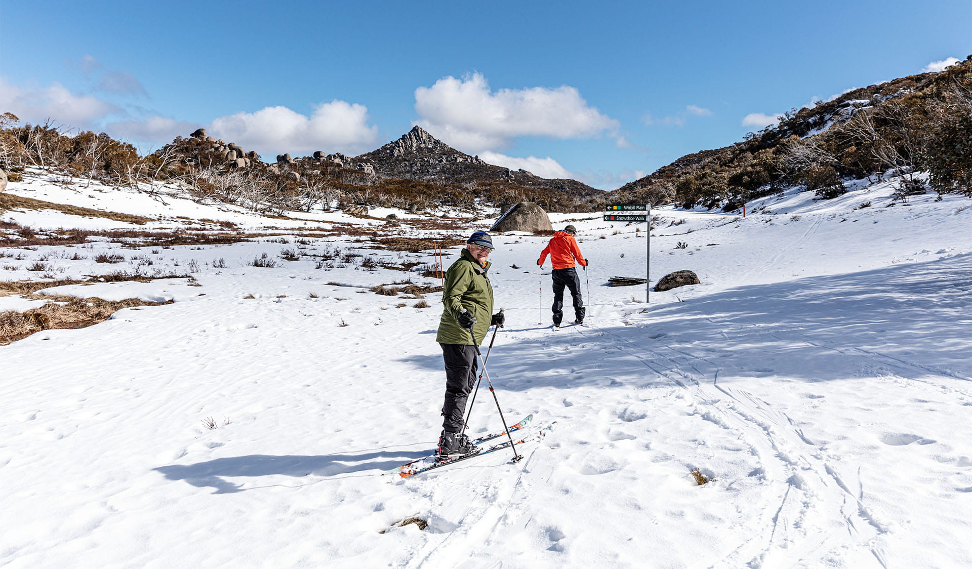 Two people cross country skiing at Cresta Valley in Mount Buffalo National Park.