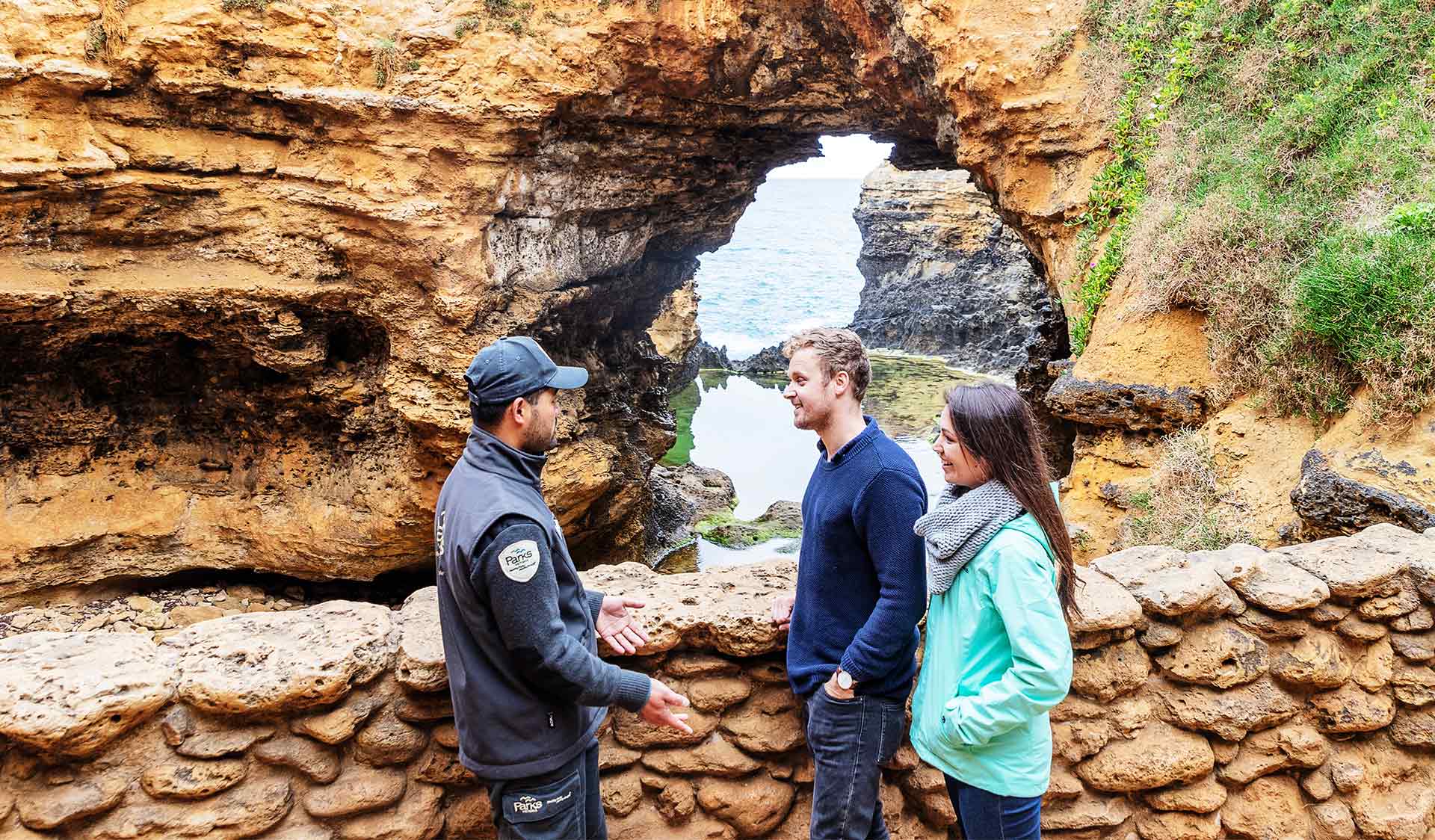 A couple talking to a Parks Victoria Ranger at The Grotto in Port Campbell National Park