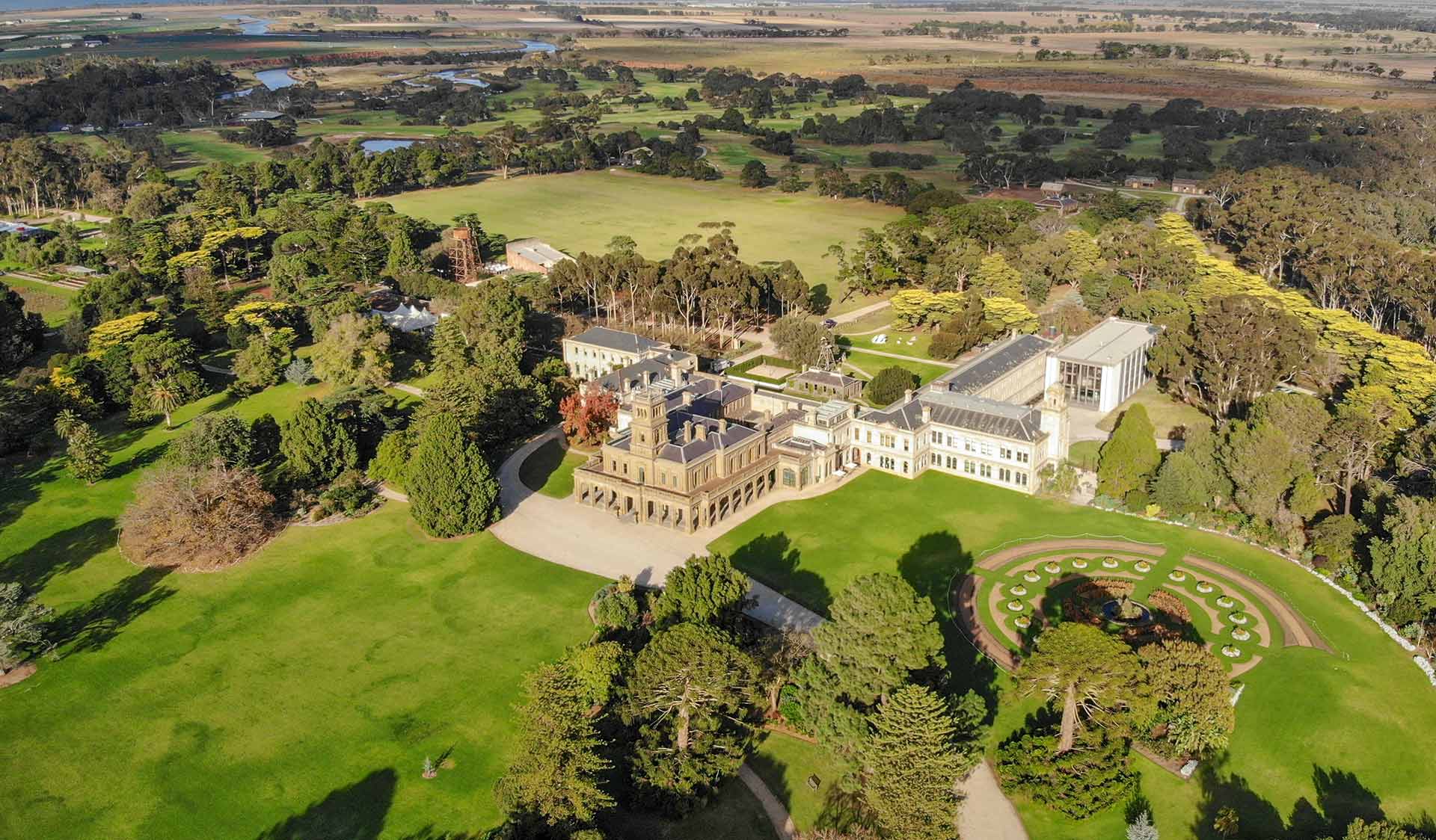 An aerial view of Werribee Mansion and its surrounding gardens.