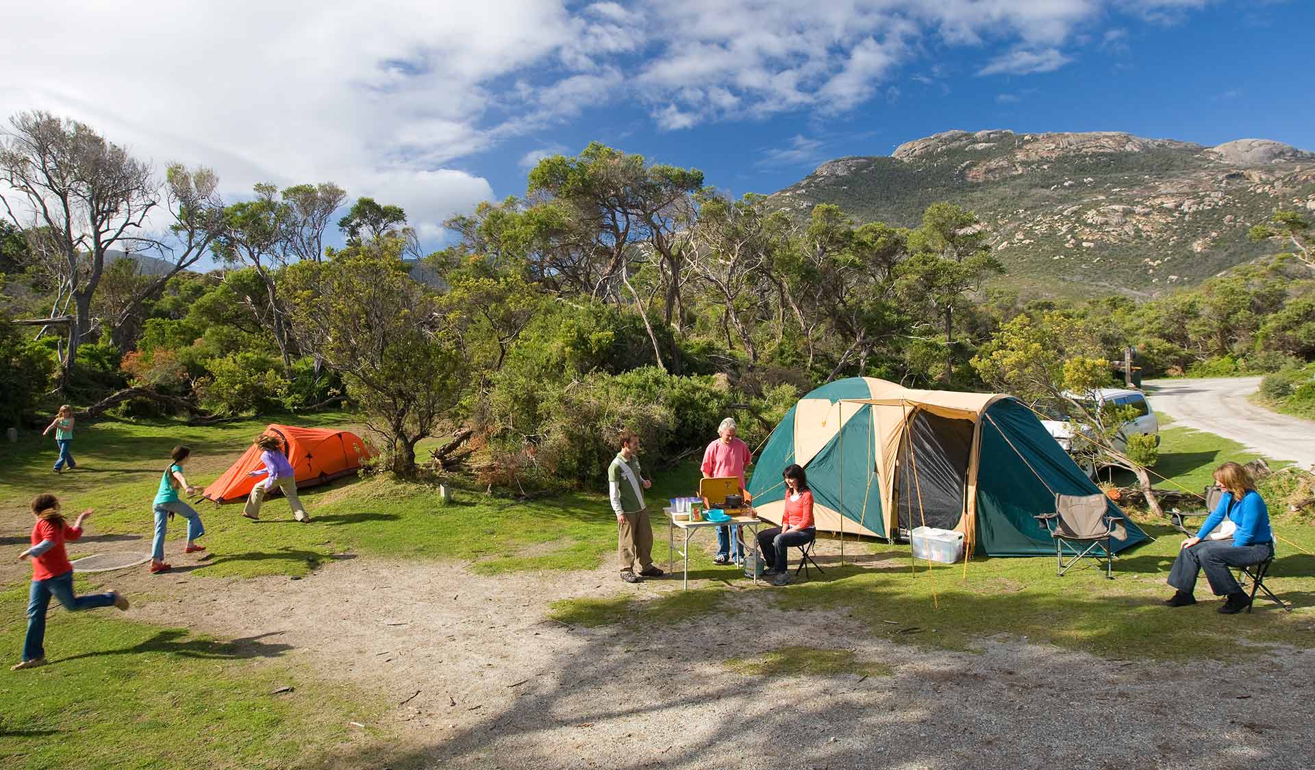 A family set up camp at Tidal River Camp Ground at Wilsons Promontory National Park.