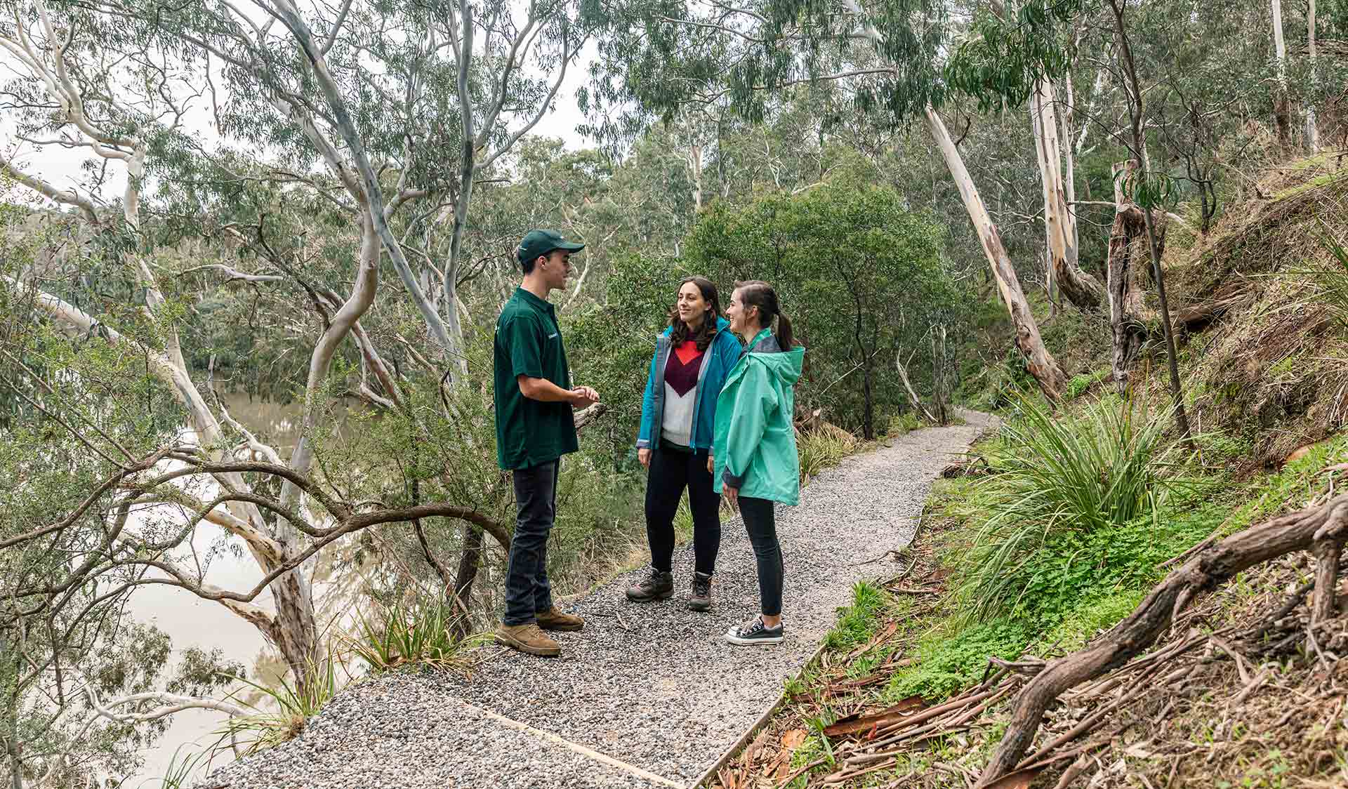 Two women take a volunteer led tour through the Flying Fox environments on the banks of the Yarra River in Yarra Bend Park