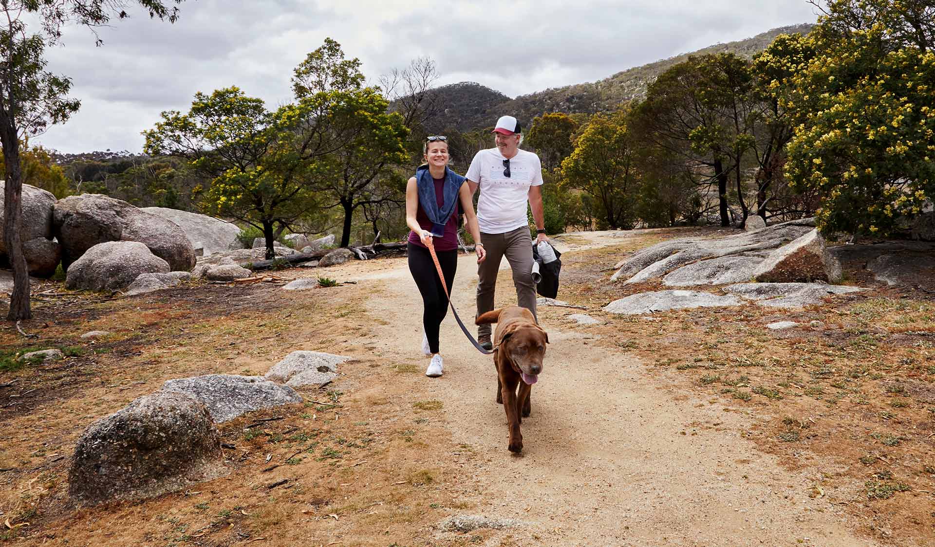 A couple walking their dog at Big Rock Walking Track