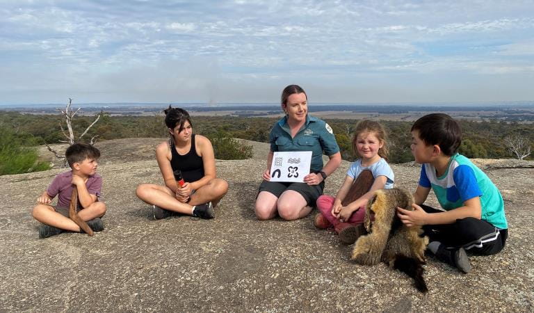 A ranger educating a group of seated kids at You Yangs Regional Park