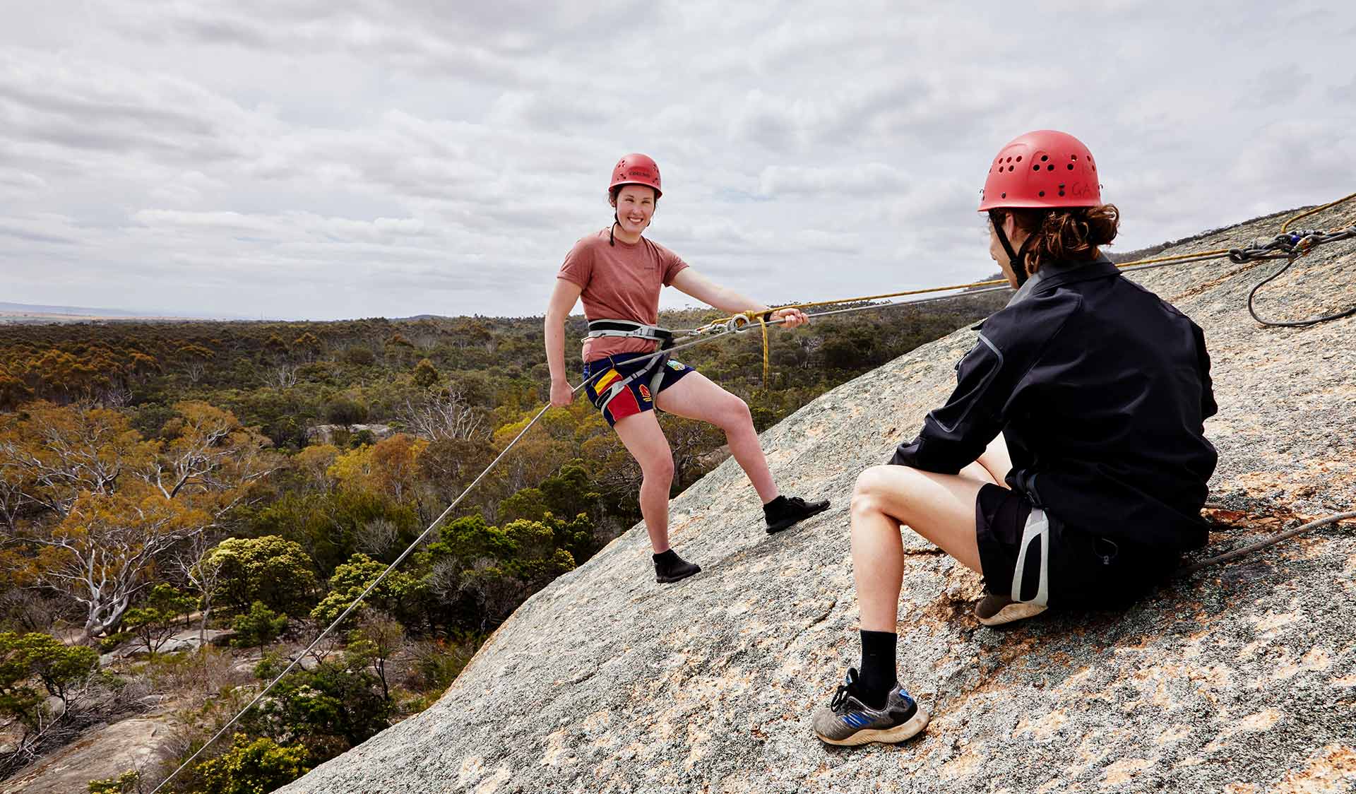 A young girl abseiling at Big Rock in You Yangs Regional Park