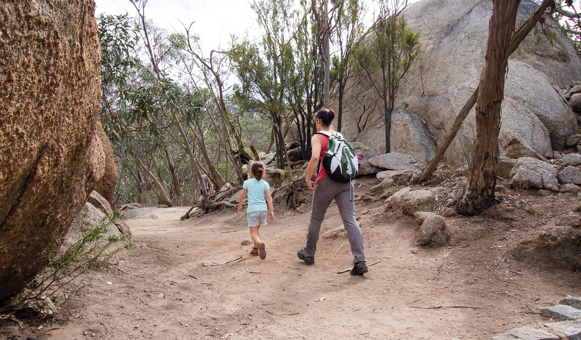 Woman and child hiking along a trail in You Yangs Regional Park