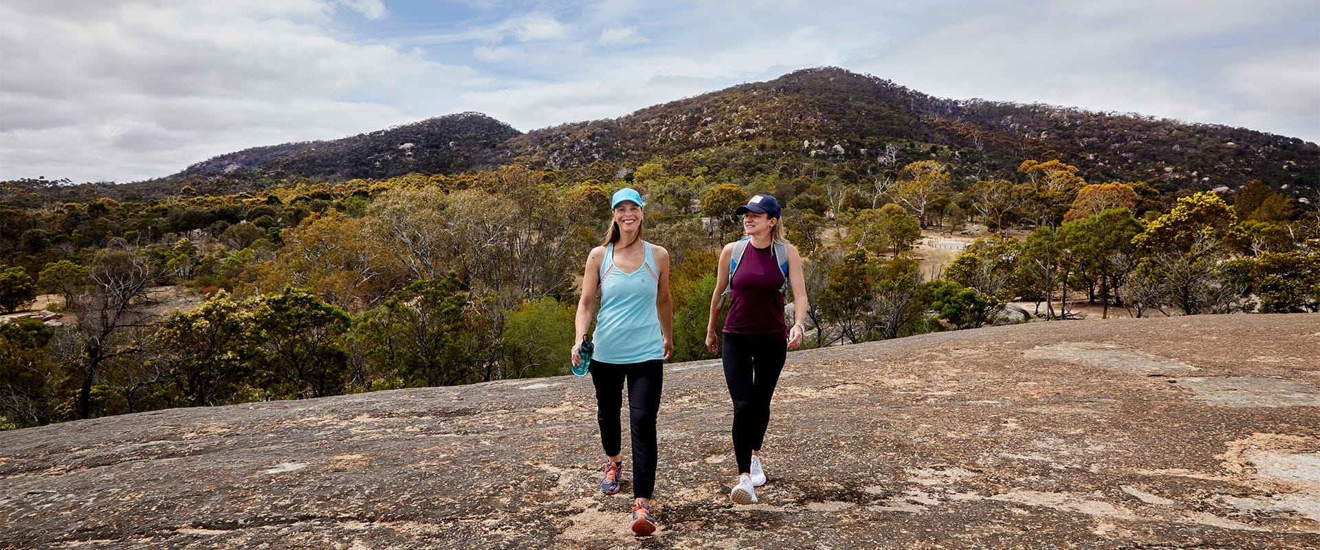 Two women walking for fitness at Big Rock in You Yangs Regional Park.