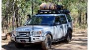 A 4WD with a swag on the roof.