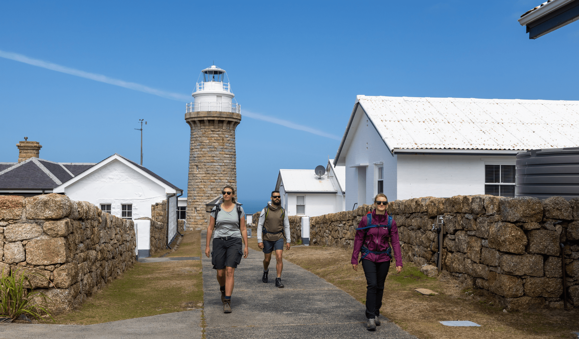Hikers departing cottages at lightstation