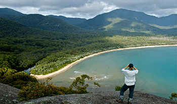 A woman looks out over Sealers Cove in Wilsons Promontory National Park