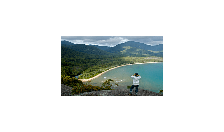 A woman looks out over Sealers Cove in Wilsons Promontory National Park