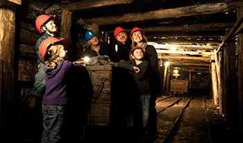 A family touring the State Coal Mine
