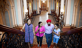 A family doing an audio tour at Werribee Mansion