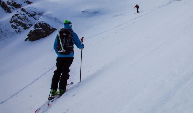 Two ski tourers ascend a gully on Mount Bogong in the Alpine National Park