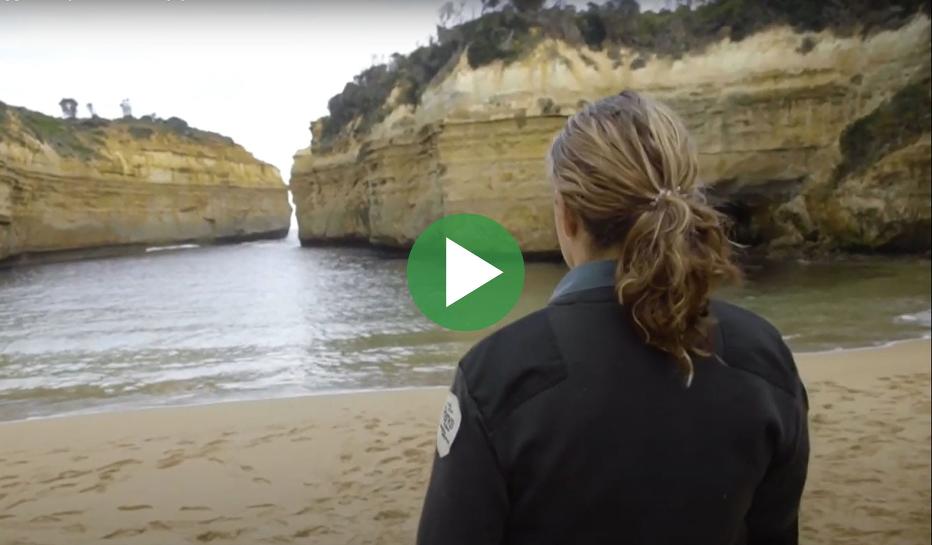 Image still from Bigger Than You - enjoy the moment video, with play icon overlay.