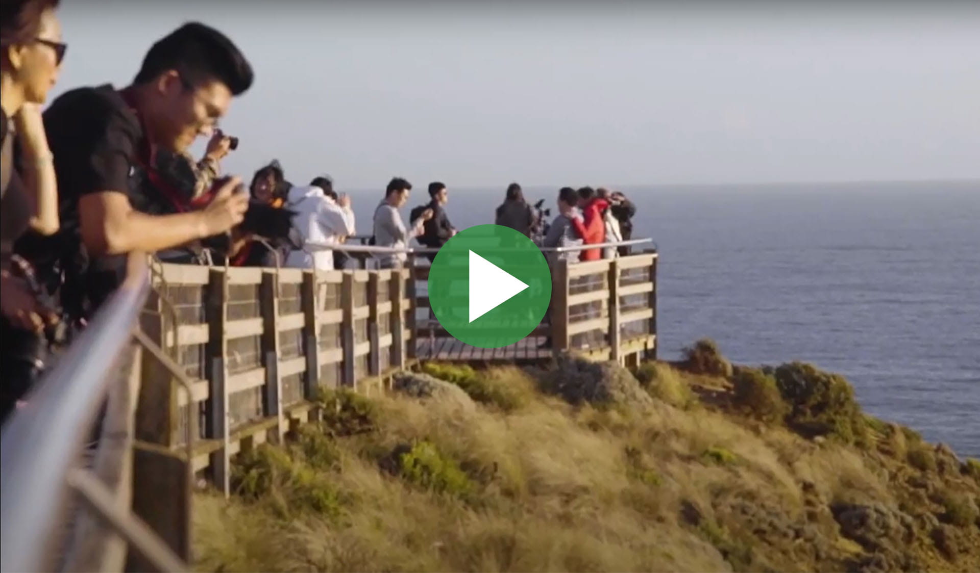 Image still from Bigger Than You - stay behind barriers video, with play icon overlay.