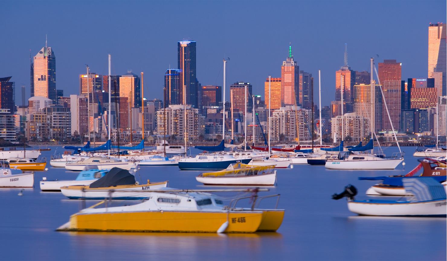moored yachts with melbourne city skyline in the background